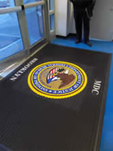 Custom Made Logo Mat Purchased On GSA Contract - Department Of Justice Metropolitan Detention Center Brooklyn New York