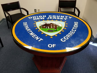 Custom Made Mahogany Wood Logo Table - Union County Jail
